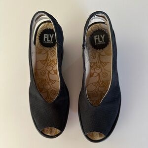 Fly London black peep-toe wedge heels.